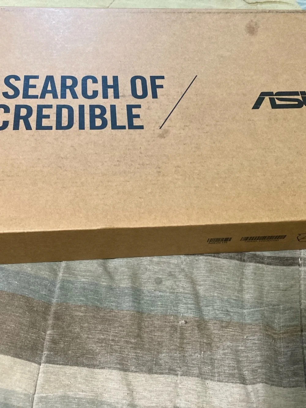 ASUS Black Laptop with Silver Logo - Compact Notebook